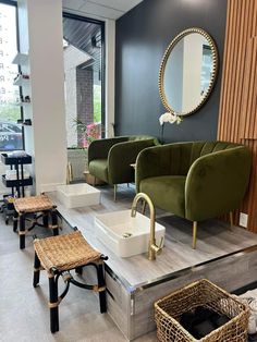 a salon with chairs, stools and mirrors on the wall next to each other