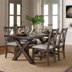 This 5-piece dining set brings a casual and warm feel to your eat-in kitchen or dining room. It includes four classic side chairs and a rectangular table with a timber beam trestle base and a plank top. Each piece is crafted from kiln-dried solid and engineered wood with a mocha brown finish. The chairs show off X-cross backs and oatmeal-toned faux leather seats for a modern farmhouse look we love. Our favorite part? An 18" leaf comes with this set to extend the table top to 80" wide, accommodat Dc House, Silver Furniture, Trestle Dining Tables, 7 Piece Dining Set, Solid Wood Dining Chairs, 5 Piece Dining Set, Coaster Furniture, Dining Room Set, Farmhouse Dining