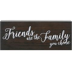 a wooden sign that says friends are the family you choose