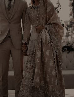 a man and woman dressed in wedding attire