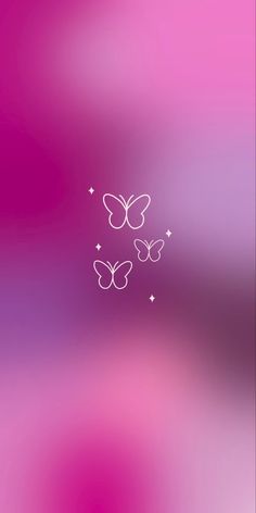 a pink and purple blurry background with two white butterflies on the left side of the screen