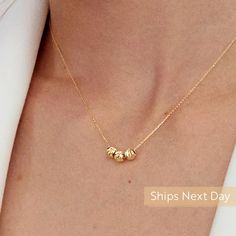 "Our 14k Gold Sphere necklace is the representation of being simple and stylish. Wear this to add triple classic touches to your outfit with a gold necklace. After all, you cannot go wrong with classics. D E T A I L S * Made to Order. * 100% 14k Solid Gold * Choice of Gold Color: Yellow Gold, Rose Gold, White Gold * Pendant Height: 5 mm / 0.19 inch * Pendant Width: 15 mm / 0.59 inch * Length: 14\", 16\", 18\", 20\", 22\" (Got a little note that can help you in the photos.) * Ready to Ship in 1-3 Elegant Everyday Gold Custom Necklace, Elegant Everyday Custom Gold Necklace, Gold Necklaces With Polished Beads For Everyday, Everyday Gold Necklaces With Polished Beads, Everyday Gold Necklace With Polished Beads, Elegant 14k Gold Jewelry With Gold Beads, Elegant Charm Necklaces With Round Beads As Gifts, Everyday 14k Gold-filled Necklaces With Gold Beads, Elegant Anniversary Necklace With Polished Beads