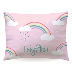 a pink pillow with rainbows, clouds and hearts on it that says leghorn