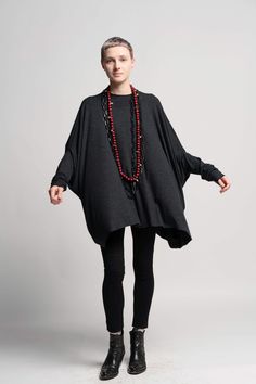 This comfortable oversized round neck Gray tunic top is such a great addition to your wardrobe. It can be worn in both summer and winter.  In summer pair it with leggings or shorts, In winter pair it with funky warm leggings or jeans. Color - Grey Material: 80% viscose 20% polyester Sizes: One Size Bust: 230cm/ 90" Length: 71cm /  28" Care instructions: - Turn garment inside out before washing - Hand wash in cold water separately from other garments - Do not bleach - Do not harshly scrub a specific spot - Do not tumble dry - Hang to dry in the shade, turned inside out View my store for more beautiful items: https://www.etsy.com/shop/UrbanicTribe Like my FB page to be the first to know about new designs, promotions and special offers: https://www.facebook.com/pages/Urbanic-Tribe/71035568572 Tunic And Leggings Outfit Plus Size, Layered Tunic Outfit, Oversized Batwing Sleeve Poncho, Oversized Tunic For Layering, Casual Oversized Poncho For Layering, Oversized Batwing Sleeve Sweater For Layering, Lagenlook Tunic For Layering With Relaxed Fit, Oversized Casual Poncho For Layering, Oversized Tunic For Fall Layering