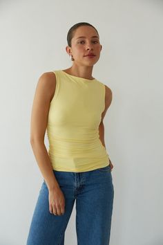 Front view | yellow-image | yellow butter mock neck side ruched soft top | simple basics top Butter Yellow Top Outfit, Sleeveless Summer Tops With Ruched Back, Summer Stretch Tank Top With Ruched Back, Stretch Tank Top With Ruched Back For Summer, Versatile Ruched Tops For Spring, Summer Tops With Ruched Back, Chic Summer Tops With Ruched Back, Stretch Ruched Scoop Neck Tops, Fitted Casual Top With Ruched Back