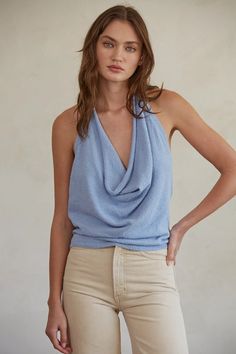 Embrace your summer wardrobe with the Open Back Halter Cowl Neck Sleeveless Top Dusty Blue! This will be your go-to top of the season whether you're headed to the beach or a brunch! The towel-like texture makes it perfect to throw over a bathing suit... Beachy Sleeveless Halter Top For Beach Season, Sleeveless Halter Top For Beach Day Out, Sleeveless Halter Top For Beach Season Day Out, Sleeveless Halter Top For Day Out At The Beach, Summer Beach Halter Top, Sleeveless Halter Top For Beach In Summer, Sleeveless Halter Top For Summer Beach, Beachy Sleeveless Tank Top For Spring, Blue Sleeveless Halter Top For Beach Season