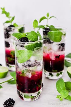 blackberry mojits with mint and lime garnish in glasses