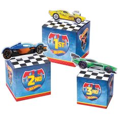 three boxes with cars on them sitting next to each other