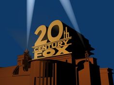 the 20th century fox sign is lit up in front of a building with two spotlights