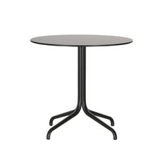 a round table with black metal legs and a white top, on an isolated white background