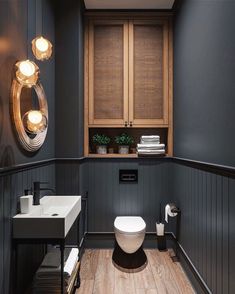 a bathroom with wooden floors and gray walls