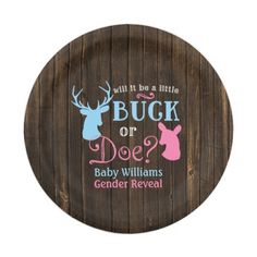 a wooden plate with the words buck or doe? and an image of a deer's head on it