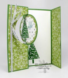 an open card with a christmas tree on it