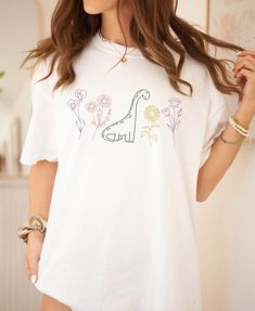 Dinosaur Party Outfit Women, Casual White Shirt With Dinosaur Print, White Dinosaur Print T-shirt For Summer, Short Sleeve White Tops With Dinosaur Print, White Short Sleeve Tops With Dinosaur Print, White Short Sleeve Top With Dinosaur Print, Cotton Tops With Dinosaur Print For Spring, Unisex White Top With Dinosaur Print, Summer Dinosaur Print Crew Neck Shirt