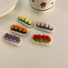 small crocheted objects sitting on top of a table