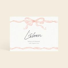 a wedding card with pink ribbon and bow on the front, which reads lisson