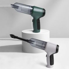 two hair dryers sitting on top of each other