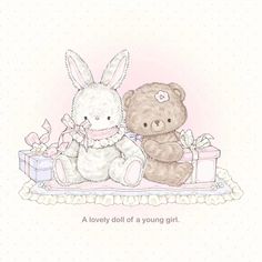 two brown teddy bears sitting next to each other on a table with a gift box