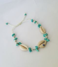 ------♥ ♥ ♥ bohomila ---- bohomian sea shell anklet ♥ Natural sea shell 1)-------♥ Seed bead boho anklet 9 inch +1 inc extender chain 2)-------♥Natural sea shell and turquoise bead adjustable anklet ♥ Gold plated chain and lobster claw ♥ anklet is handmade FOR MORE Anklet, check out our shophttps://www.etsy.com/shop/bohomila?ref=search_shop_redirect Thank you for looking through our shop. If you have any further questions feel free to message me! Stay beautiful lovelies. Bohemian Shell Beaded Bracelets, Handmade Strand Anklet For Vacation, Handmade Turquoise Beaded Bracelets For Beach, Handmade Beachy Anklets For Beach Season, Bohemian Shell Beaded Bracelets For Vacation, Bohemian Strand Anklet As Gift, Handmade Beachy Anklets For Vacation, Handmade Beachy Strand Anklets, Bohemian Beaded Strand Bracelets For Vacation