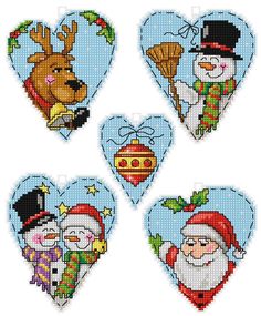 four cross stitch heart ornaments with santa claus, snowman and reindeer