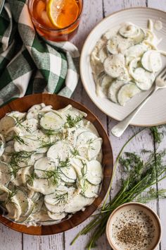 A bowl of cucumber salad sits in a wooden bowl on a white table. There is a plate with some cucumber salad and a fork on it sitting off to the right. Cucumber Salad With Mayo, Dill Dressing, Creamy Cucumber Salad, Favorite Salad, Creamy Cucumbers, Famous Recipe, Summer Gathering