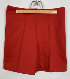 High Waisted Red Vintage 70s Shorts  Cute and comfortable primary red shorts with tuck pleat down front legs. Elastic waist with no pockets. No tag to indicate size or material. Measures MEDIUM  Polyester  Please check your measurements to ensure size accuracy. Measurements taken lying flat. Waist 15 inches with stretch to 18 inches  Hip 17 inches  Rise 12 inches Inseam 5 inches Since all sales are final, I am happy to answer any questions. Red Short Skort With Built-in Shorts, High Waist Solid Pleated Shorts, Solid High Waist Pleated Shorts, Fitted Shorts With Pleated Waist, Solid Short Pleated Bottoms, Retro Red Pleated Bottoms, Retro Red Skort For Summer, Pleated Short Shorts, Retro Red Summer Skort