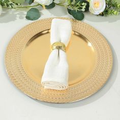 a gold plate topped with a white napkin