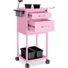 a pink cart with three drawers and two black bins on it's wheels