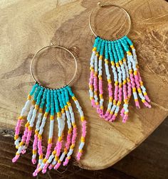 Beautiful handmade Miyuki seed bead fringe earrings are the perfect summer staple.  ~~MADE OF~~ -gold filled hoop -Miyuki seed beads -nimo thread ~~TO ORDER~~ -select quantity -free shipping over $35 ~~ADDITIONAL INFO~~ -customization not available Follow on Instagram @simplystacked_bylisa.  We'd love to see how you pair your jewels.  Be sure to tag us Handmade Beaded Earrings With Heishi Beads, Bohemian Heishi Beaded Hoop Earrings, Bohemian Hoop Beaded Earrings With Heishi Beads, Bohemian Hoop Earrings With Heishi Beads, Dangle Hoop Earrings With Tiny Beads For Beach, Hoop Beaded Earrings With Dangling Beads For Beach, Beach Heishi Beaded Earrings, Bohemian Heishi Beads Earrings For Beach, Heishi Beads Beaded Earrings For Beach