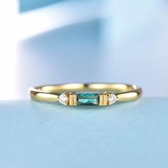 This is a lab emerald and natural diamond wedding ring,matching band,stacking ring.A perfect anniversary gift, birthday gift,wedding engagement ring.Great as a gift or a anniversary ring.Ring Information<><><><><><><><><><><><><><><>Stone*2x4mm baguette cut lab created emerald.*1.5mm natural diamondMetal* Solid 10k 14k &18k.*Color:white gold,yellow gold,rose gold.Custom Order<><><>< Engagement Ring Upgrade, Emerald Engagement Ring White Gold, Pink Moissanite Engagement Ring, Birthstone Wedding Band, White Gold Emerald Ring, Wedding Ring Matching, Gold Emerald Ring, Black Crystal Earrings, Diamond Ring Unique