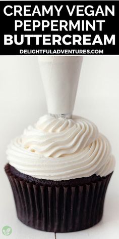 a chocolate cupcake with whipped cream on top and the words creamy vegan peppermint buttercream above it