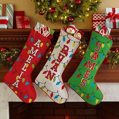 three christmas stockings hanging from a mantel