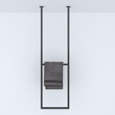 a towel rack with two towels hanging from it's sides and one folded up