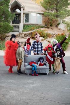 group of people dressed up in costumes posing for the camera