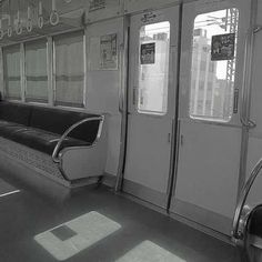 a black and white photo of the inside of a train