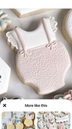 the cookies are decorated with white icing and pink frosting, along with other cookie decorating items