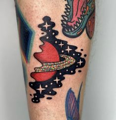 a colorful tattoo on the leg of a man