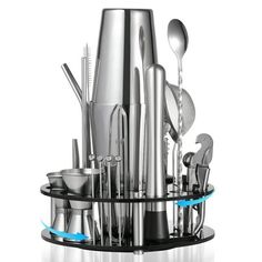 an assortment of stainless steel kitchen utensils and spoons on a black stand