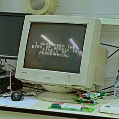 an old computer monitor sitting on top of a desk