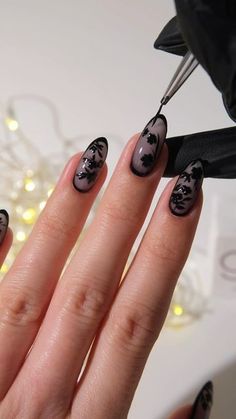 Amber Hancock on Instagram: "AD Dark Florals�🖤🥀 The perfect mani for spooky season if Halloween nails aren’t your thing!  Products used @the_gelbottle_inc  Glass Black & Jet black over Bella BIAB   #halloweennails #darknails #blacknails #floralnails #fallnails #nailart #autumnnails dark nails, black nails, Halloween nails, floral nail art" Dark Nails Simple Design, Black And Cat Eye Nails, Black Almond Acrylic Nails Design, Fall Flowers Nail Art, Dark Feminine Energy Nails, Simple Black Gel Nails, Dark Style Nails, Glass Black Nails, Black Nails Flower Design