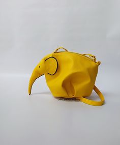 ♥Limited edition! This listing is for one lemon-yellow ECO leather elephant bag! One of the best accessories bohemian cross-body bag is truly unique! Perfect for your personal objects, coins, decorative objects, jewelry, or other valuable items and accessories such as electronic devices (smartphones, chargers...) This clutch is very strong and durable, fashionable, classic but very stylish, perfect for your daily life, for a unique look, special occasions or events, etc. This is my favorite purs Yellow Pouch Shoulder Bag With Mobile Phone Pocket, Yellow Pouch Bag For Mobile Phone, Yellow Tote Satchel With Mobile Phone Bag, Yellow Crossbody Bag Gift, Yellow Mobile Phone Bag As Gift, Yellow Handheld Bags For Daily Use, Yellow Bag With Adjustable Strap As Gift, Yellow Bags With Adjustable Strap As Gift, Yellow Satchel Shoulder Bag For Gifts