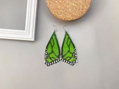 🦋Hundreds of tiny Czech seed beads were woven together by hand to create these beautiful earrings inspired by a green butterfly pattern. The earrings are light and comfortable to wear.  All my earrings are made according to my own designs. When I was designing this earrings I wanted to be able to have the butterfly's with me at all time. Something I could wear during the day to bright up my casual outfit or during the night and make my outfit more chic and memorable.  A perfect gift for that sp Unique Green Butterfly Earrings, Unique Green Beaded Earrings As Gift, Handmade Butterfly Beaded Earrings For Gift, Green Wings, Green Wing, Beaded Fringe Earrings, Earrings Butterfly, Butterfly Wing Earrings, Wings Design