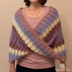 the woman is wearing a crocheted shawl