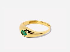 A gorgeous design, this cocktail ring is boldly unexpected. Stunning in its simplicity, the ring features an inlay pear-shaped emerald beautifully set in a gold band that packs a punch. Emerald stone size: 3mm x 5mm; Band is made of 14k gold over sterling silver. Adjustable band between size 7-9 Hypoallergenic, nickel and lead free Tarnish resistant Gold Teardrop Emerald Ring, Gold Teardrop Emerald Promise Ring, Pear-shaped Gold Emerald Ring, Caro Emerald, Dome Ring, Domed Ring, Emerald Stone, Stone Design, Gold Filled Jewelry