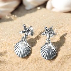 Dive into the beauty of the ocean with our stunning 925 sterling silver shell and starfish earrings. Crafted with love and attention to detail, these delicate ocean-inspired earrings are the perfect accessory for those who cherish the sea. Each pair measures 9/32 inches in width and 19/32 inches in length, making them lightweight and comfortable for everyday wear. Whether you're dressing up for a special occasion or simply adding a touch of elegance to your everyday outfit, these earrings are versatile enough to bring a little ocean charm to any look. Our earrings are beautifully handcrafted from premium 925 sterling silver, ensuring durability and a lasting shine. Each piece is stamped with "925," a testament to its quality and authenticity. The intricately designed shell and starfish mot Silver Ocean-inspired Earrings With Starfish Charm, Ocean-inspired Silver Earrings With Starfish Charm, Silver Drop Earrings With Starfish Charm, Silver Earrings With Starfish Charm As Gift, Silver Starfish Earrings For Beach, Sterling Silver Starfish-shaped Earrings With Charm, Sterling Silver Starfish Charm Earrings, Sterling Silver Starfish Earrings With Charm, Sterling Silver Starfish Earrings