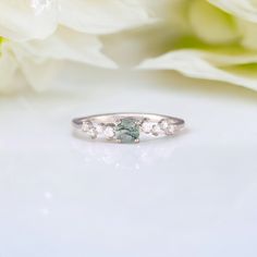 Dainty moss agate promise ring for her, Unique moss agate engagement ring, 925 sterling silver moss agate ring, Anniversary ring gift  ❥ Main Stone: Natural Moss Agate, Round Cut 4 mm ❥ Side Stones: Round cut Cubic Zirconia (CZ) ❥ Dainty 1.5mm Band (Comfort Fit) ❥ The ring has an authenticity stamp ❥ Hypoallergenic, Nickel Free and Lead-free jewelry Did you like this design? Just visit our shop because we have many more that you'll love ✨ - https://jaipurjewelscrafts.etsy.com ---> 🎁 GIFT WRAPPI Moss Agate Round Promise Ring, Elegant Silver Moss Agate Rings, Moss Agate Engagement Ring, Promise Ring For Her, Agate Engagement Ring, Moss Agate Ring, Promise Rings For Her, Agate Ring, Jewelry Business