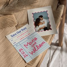 a couple's save - our - date card and wedding photo on a chair