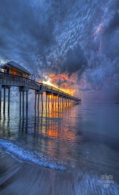 a pier with the words good night friends in front of it and sunset behind it