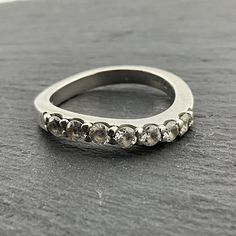 Vintage Cubic Zirconia Sterling Silver Half Eternity Ring, UK Size P, US Size 7 1/2, EU Size 55 1/4, Stamped 925, Front Width 2.6mm, Weight 3.70 Grams, Lovely Condition Modern Crystal Ring With Vvs Clarity For Anniversary, Silver Crystal Ring With Single Cut Diamonds For Anniversary, Modern Rings With Round Stone For Anniversary, Modern Crystal Ring With Prong Setting, Anniversary Silver Crystal Ring With Single Cut Diamonds, Modern Stackable Rings With Single Cut Diamonds For Anniversary, Modern Round Cut Crystal Ring For Anniversary, Modern Cubic Zirconia Eternity Band For Anniversary, Silver Oval Diamond Ring With Half Eternity Band