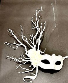 Vegan mask-  NYC Masked ball- Save Venice -Masquerade Ball- Mardi Gras Mask -All white party. Hello,        Made and shipping this one in 1 business day. One of a kind.         Perfect for a masquerade party, birthday celebration, Party celebration, Wedding mask or Mardi Gras. Flowers and branches are  white white.  the branches are made of plastic so they won't break and they're are soft enough so  they are not dangerous.  It's on a very comfortable mask...Adult only. It's a cardboard molded over a plastic mask... makes it durable.  -------------------------------------------------- To return to my shop: https://www.etsy.com/shop/doramarra?ref=si_shop ------------------------------------------------  I ship US Postal Service.       USA DOMESTIC CHOICES  (From mailed date in business days) Mardi Gras Flowers, White Masquerade Mask, White Branches, Plastic Mask, Mask White, Masked Ball, All White Party, Masquerade Masks, Mardi Gras Mask